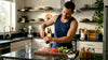 Man preparing protein meal in kitchen