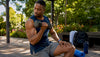 Fit black man lifting weights in gym