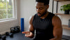 Fit black person taking supplements capsules