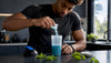 Athlete scooping clean energy supplement powder