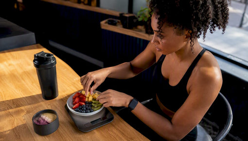 Hands measuring healthy food portion on scale