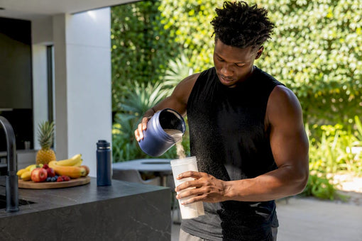 Black athlete pouring protein powder into shaker