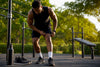 Black male athlete adjusting gym shorts hem