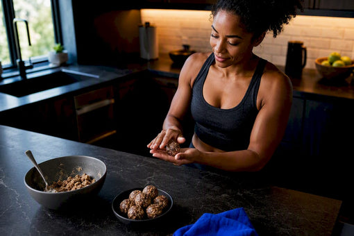 Black woman rolling no-bake protein balls