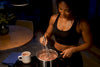 Black woman whisking creamy protein hot chocolate