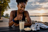 Black runner preparing a post-run protein shake
