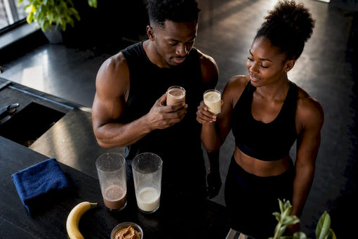 Black athletes comparing chocolate and vanilla protein drinks