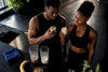 Black athletes comparing chocolate and vanilla protein drinks