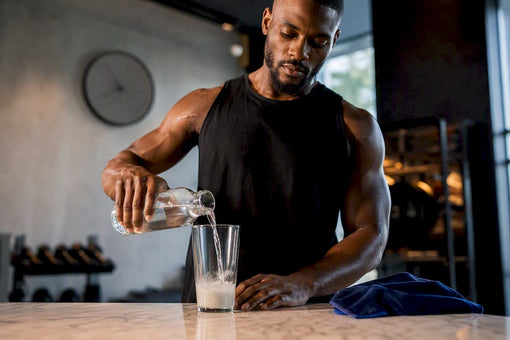 Black athlete preparing pre-workout before training