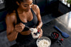 Black woman preparing cottage cheese protein pudding