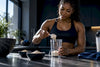 Black athlete comparing protein powder portions