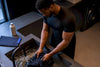 Black athlete hand-washing compression shirt