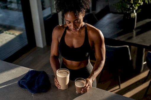Black athlete comparing two shake portions
