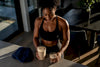 Black athlete comparing two shake portions
