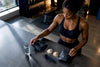 Black lifter choosing between supplement options