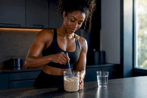 Black athlete whisking clumpy protein powder