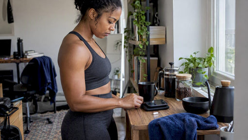 Black woman measuring caffeine and theanine beside coffee