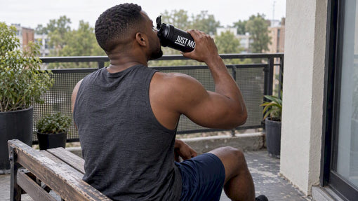 Black lifter drinking a rest day shake