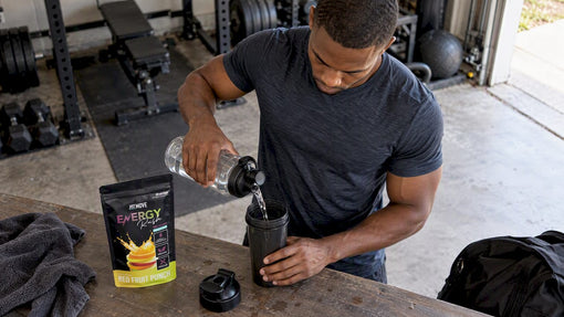 Black athlete preparing pre-workout in a shaker