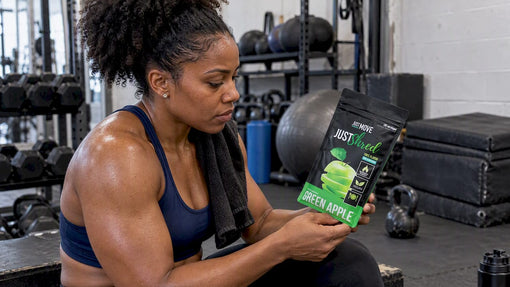 Black athlete checking a thermogenic supplement after training