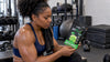 Black athlete checking a thermogenic supplement after training